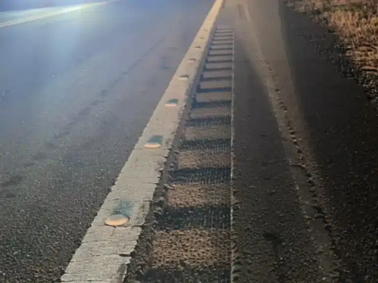 Highway shoulder with edge line and rumble strips