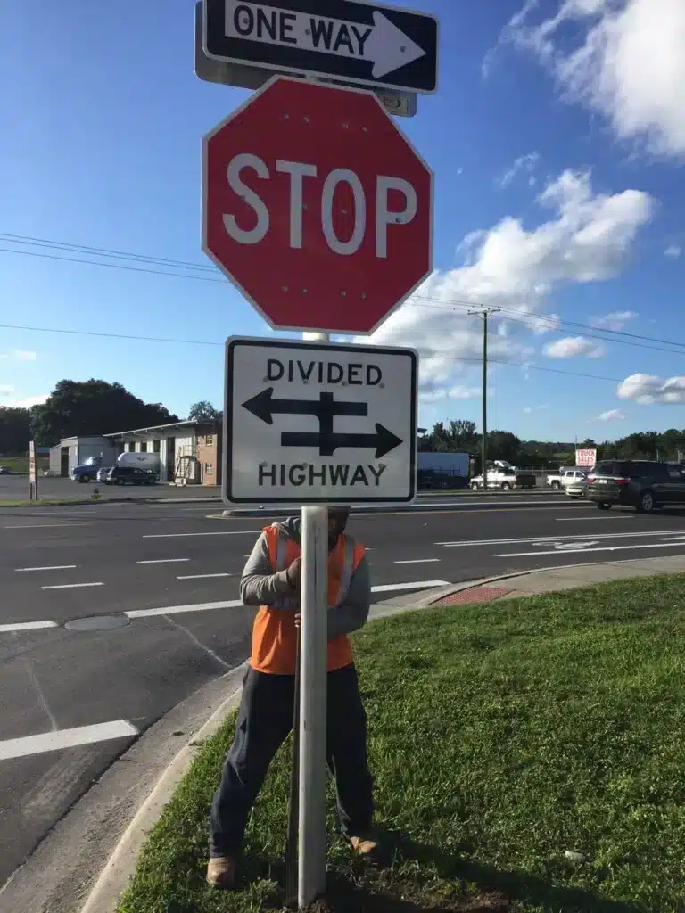 Stop sign and divided highway traffic signage