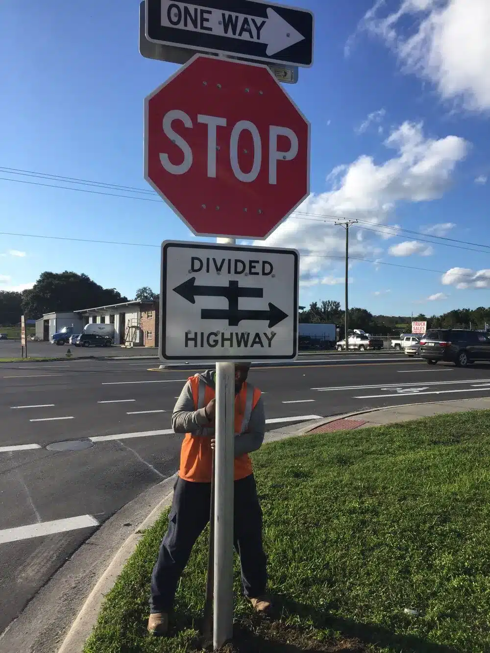 Stop sign and divided highway traffic signage